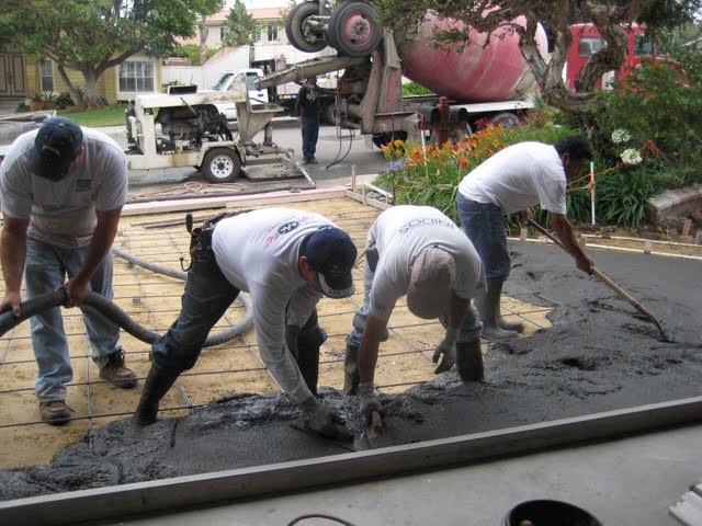 A concrete construction crew installing a new driveway